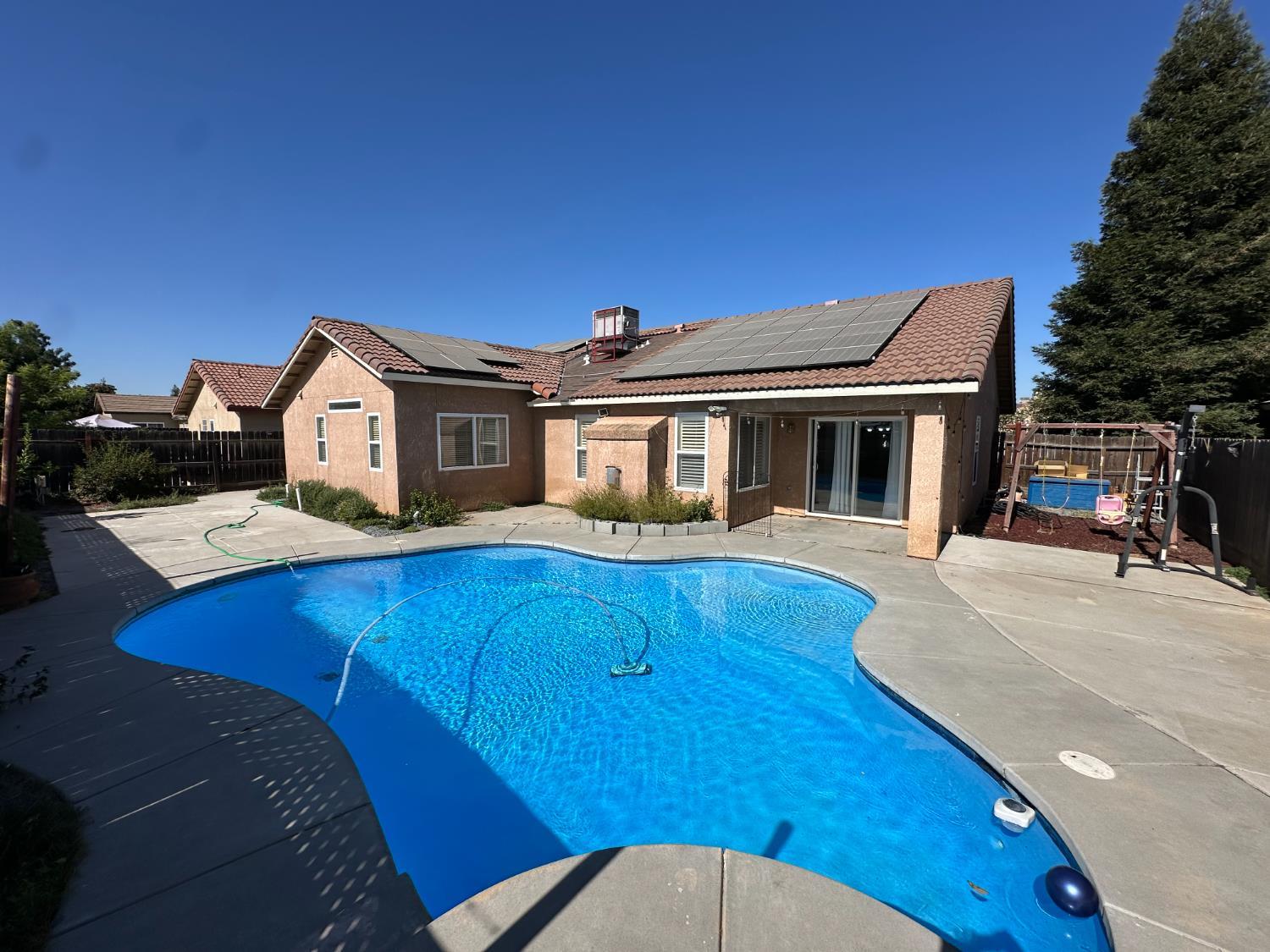 220 South Double Tree Way Madera, CA 93637 - Photo 59 of 69 a aerial view of a house with swimming pool