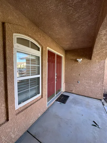 a view of a livingroom with a ceiling fan and window