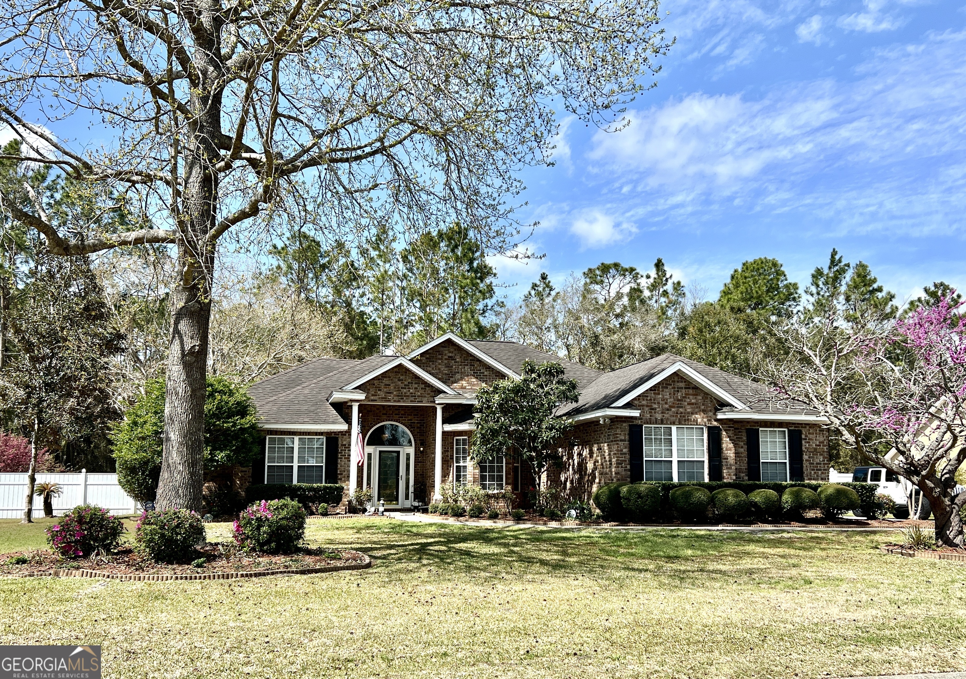 a front view of a house with a yard