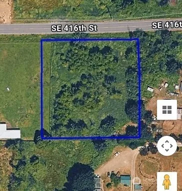 a view of a sign board with a park