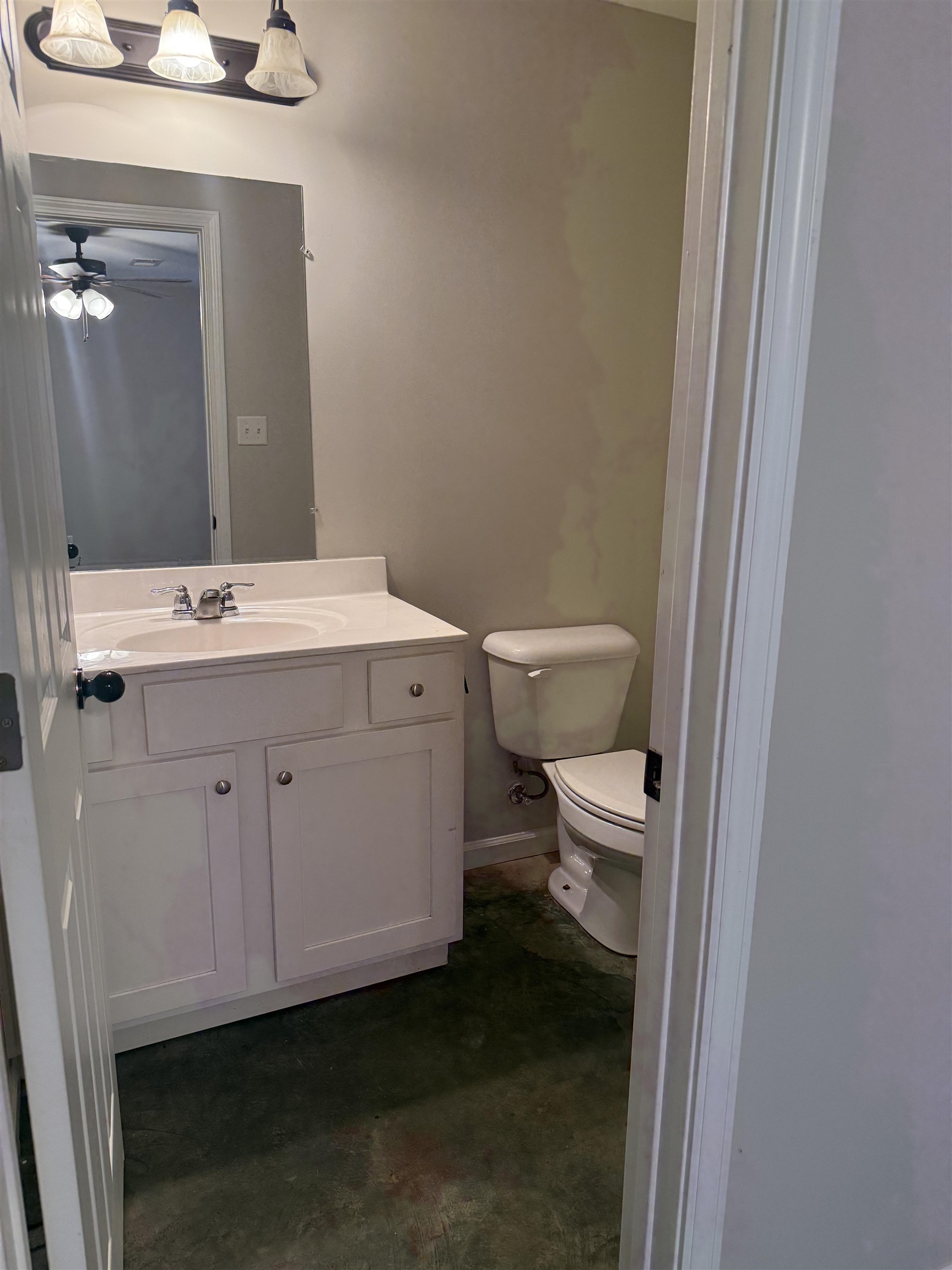 4589 Range Line Road Memphis, TN 38127 - Photo 8 of 25 Half bath featuring vanity, concrete floors, and a ceiling fan