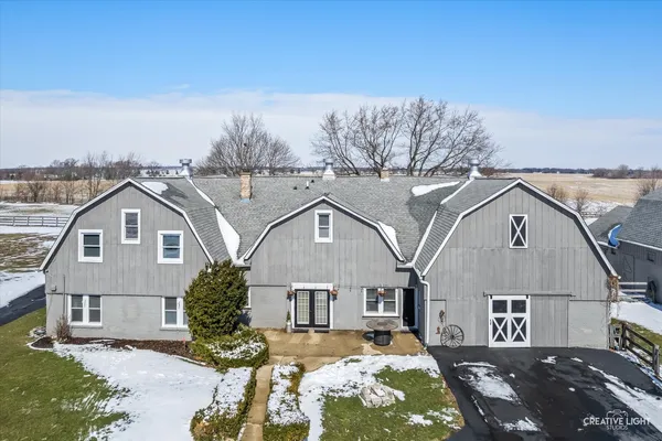 a view of a house with a snow in front of it