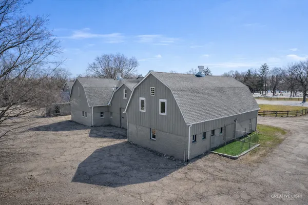 a aerial view of a house with a yard