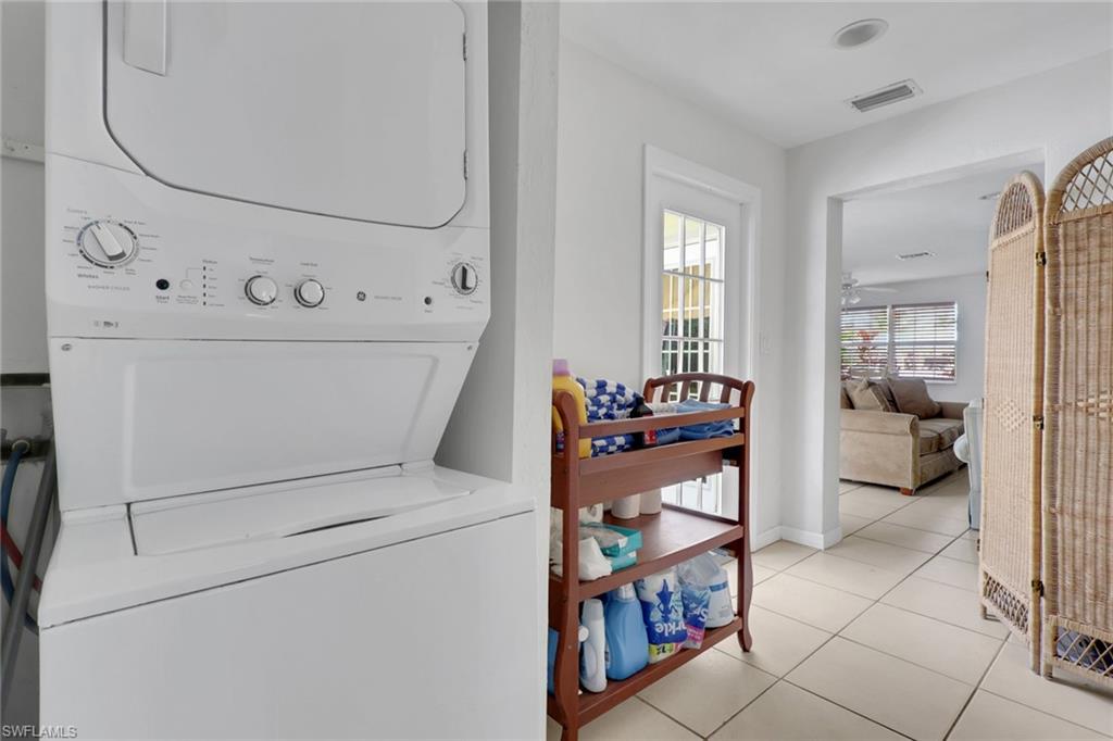 2772 Riverview Drive Naples, FL 34112 - Photo 14 of 23 a utility room with dryer and washer