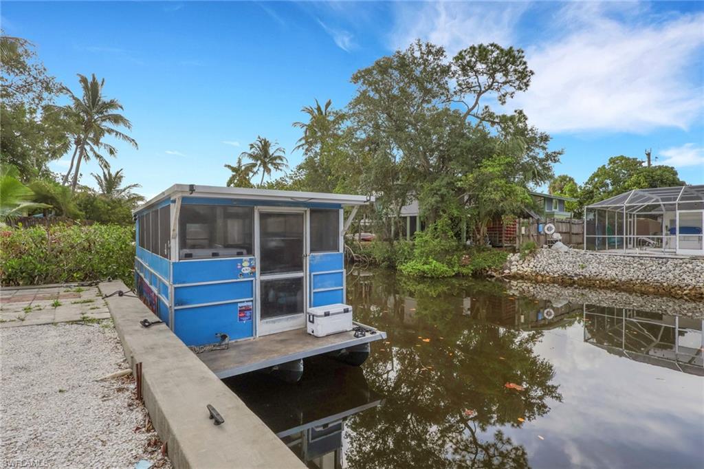 2772 Riverview Drive Naples, FL 34112 - Photo 20 of 23 a house view with a lake view