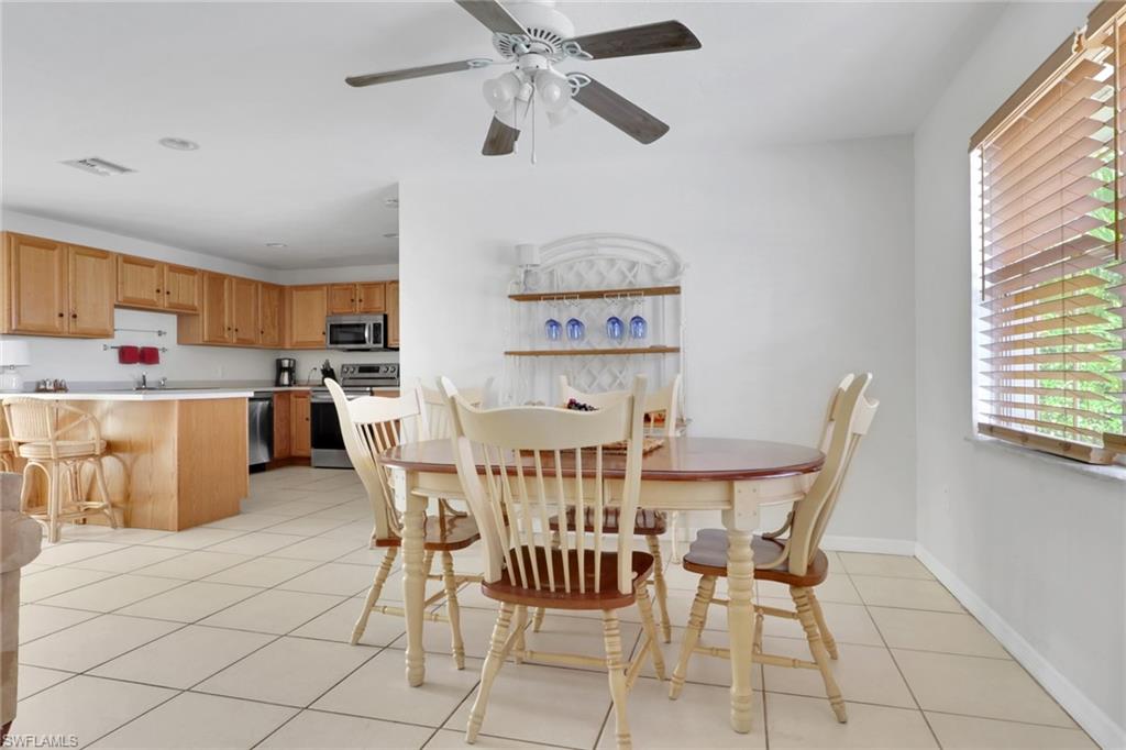 2772 Riverview Drive Naples, FL 34112 - Photo 9 of 23 a view of a dining room with furniture