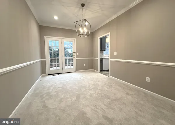 a kitchen with stainless steel appliances granite countertop a sink a stove and a microwave