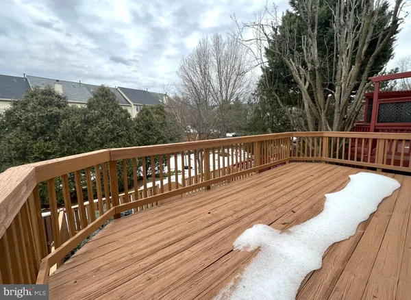 a view of balcony with wooden floor and fence