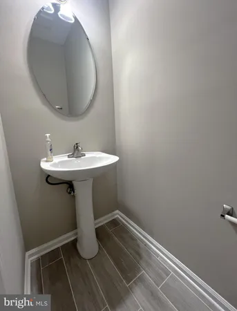 a view of balcony with wooden floor and fence