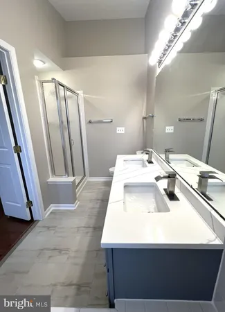 a bathroom with a toilet and shower