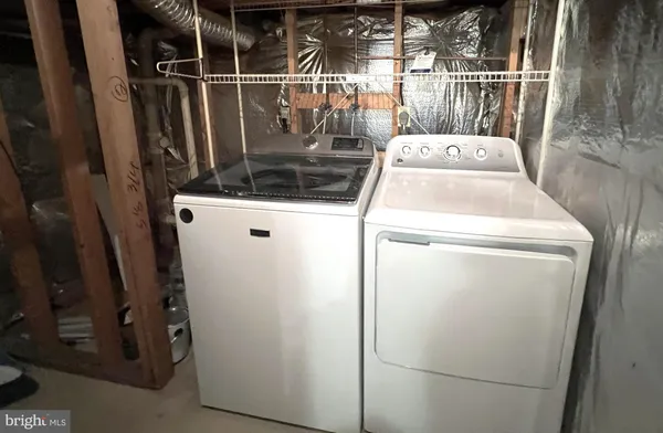 a view of a bathtub and trees in the background