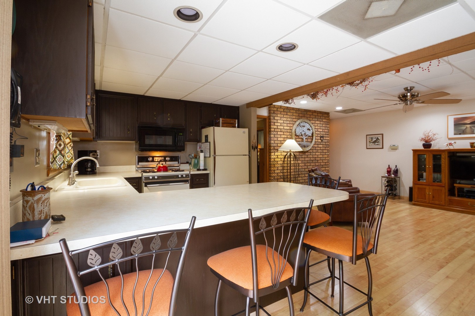 514 Windsor Road Loves Park, IL 61111 - Photo 9 of 33 a kitchen with stainless steel appliances wooden floor dining table and chairs