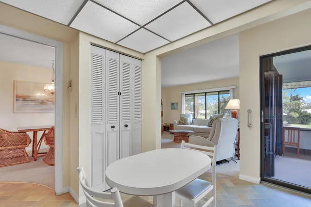 a very nice looking room with a large mirror and furniture