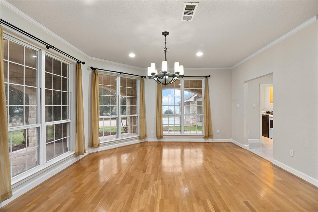 400 Indian Hills Road Gatesville, TX 76528 - Photo 26 of 38 a view of an empty room with wooden floor and a window