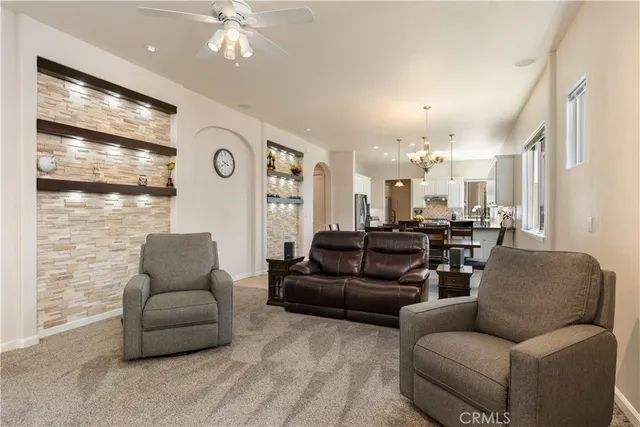 a kitchen with stainless steel appliances granite countertop a sink and a large window