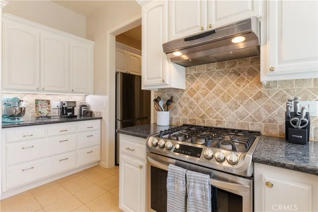 a bedroom with a bed and a lamp