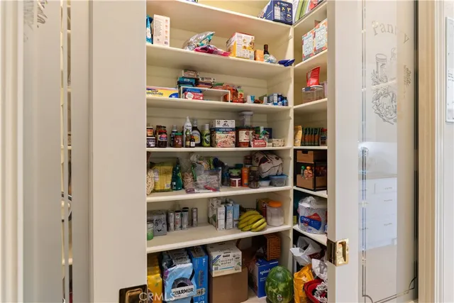 a bathroom with a granite countertop sink and a large mirror