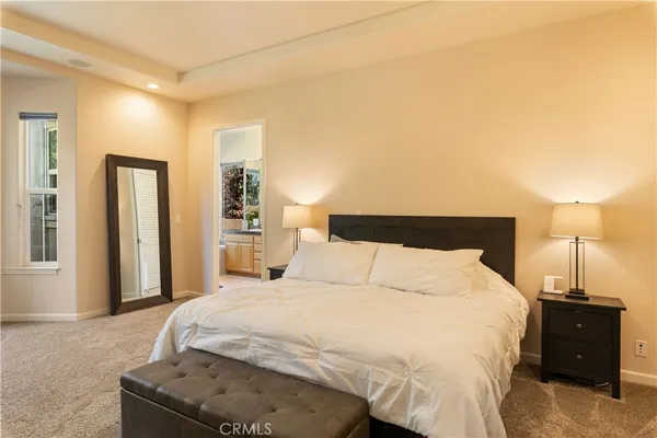 a view of a bedroom with a window and a bedroom