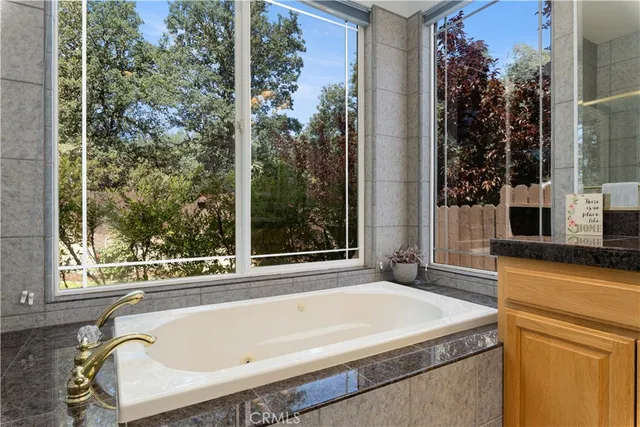 a bedroom with a bed and a flat tv screen