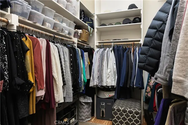 a view of a livingroom with gym equipment and furniture