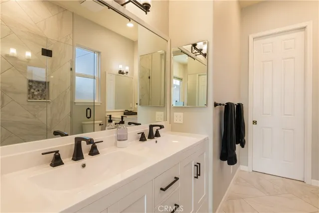 a view of a house with backyard sitting area and garden