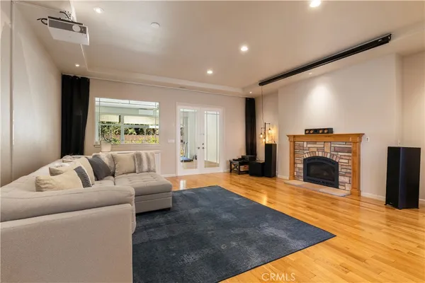a living room with furniture and a fireplace