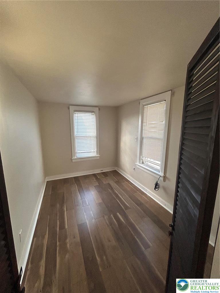 1122 East 4th Street Bethlehem, PA 18015 - Photo 10 of 13 Rich hardwood flooring complements a windowed wall in this versatile interior space.