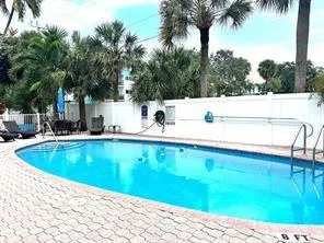 a view of a swimming pool with a patio
