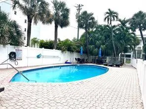 a view of a swimming pool with a patio