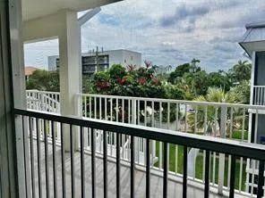 a view of a balcony with wooden floor