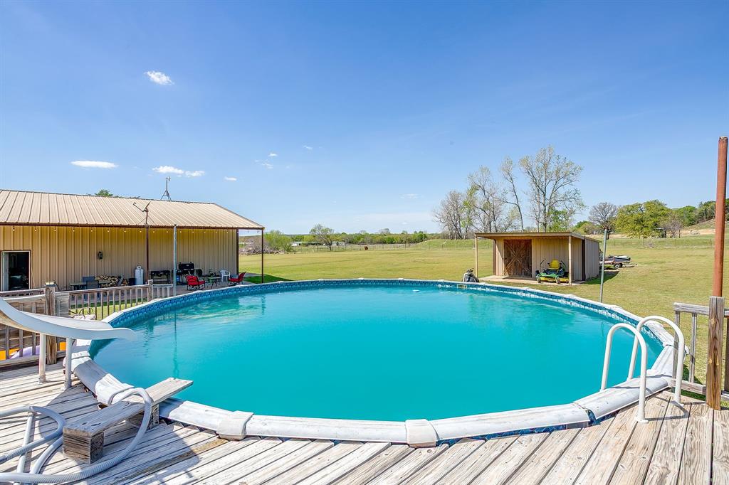 321 Young Road Millsap, TX 76066 - Photo 3 of 28 a view of swimming pool with seating space
