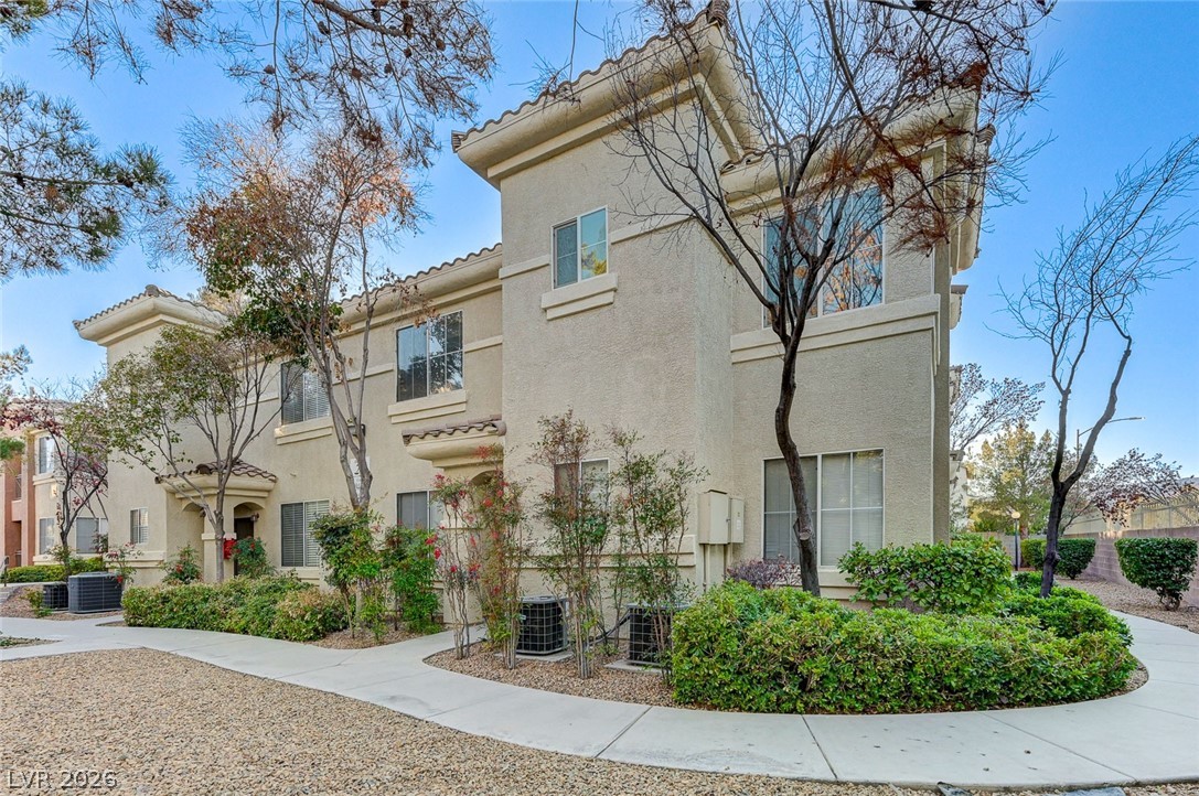 9050 West Warm Springs Road, Unit 2094 Las Vegas, NV 89148 - Photo 35 of 40 This stucco exterior building features multiple windows and a well-maintained surrounding landscape.