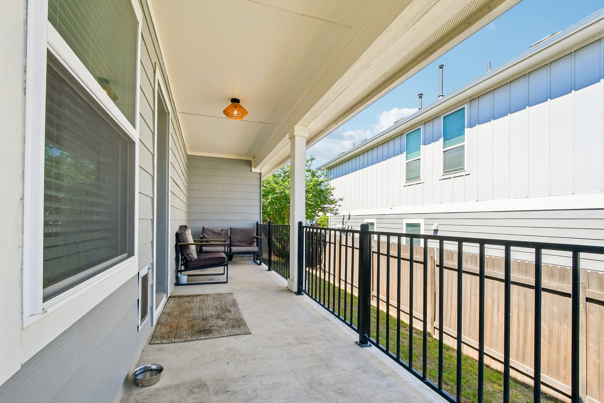 10700 Sentinel Drive Austin, TX 78747 - Photo 23 of 27 A covered patio that gives the backyard an easy everyday hangout spot.