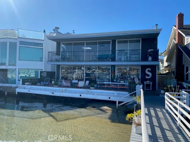 a living room filled with furniture and a fireplace