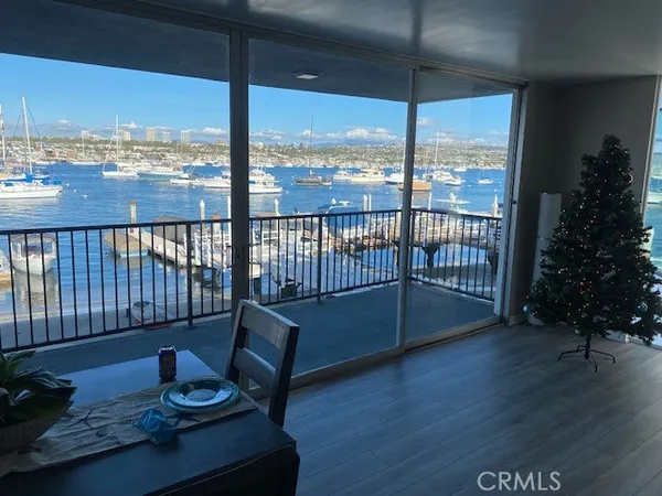 a view of a balcony with chair and wooden floor