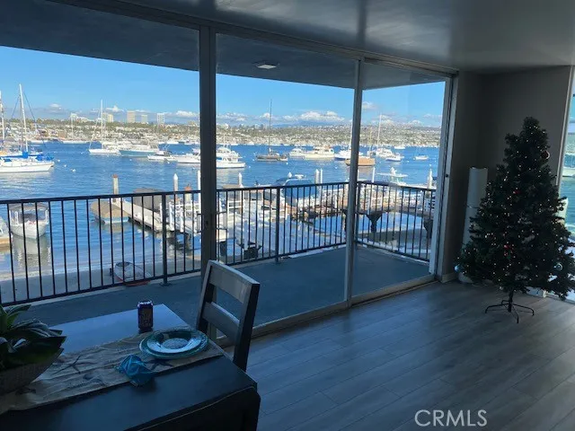 a view of a balcony with chair and wooden floor