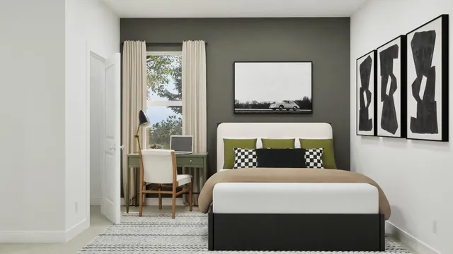 a bedroom with a large bed and a window