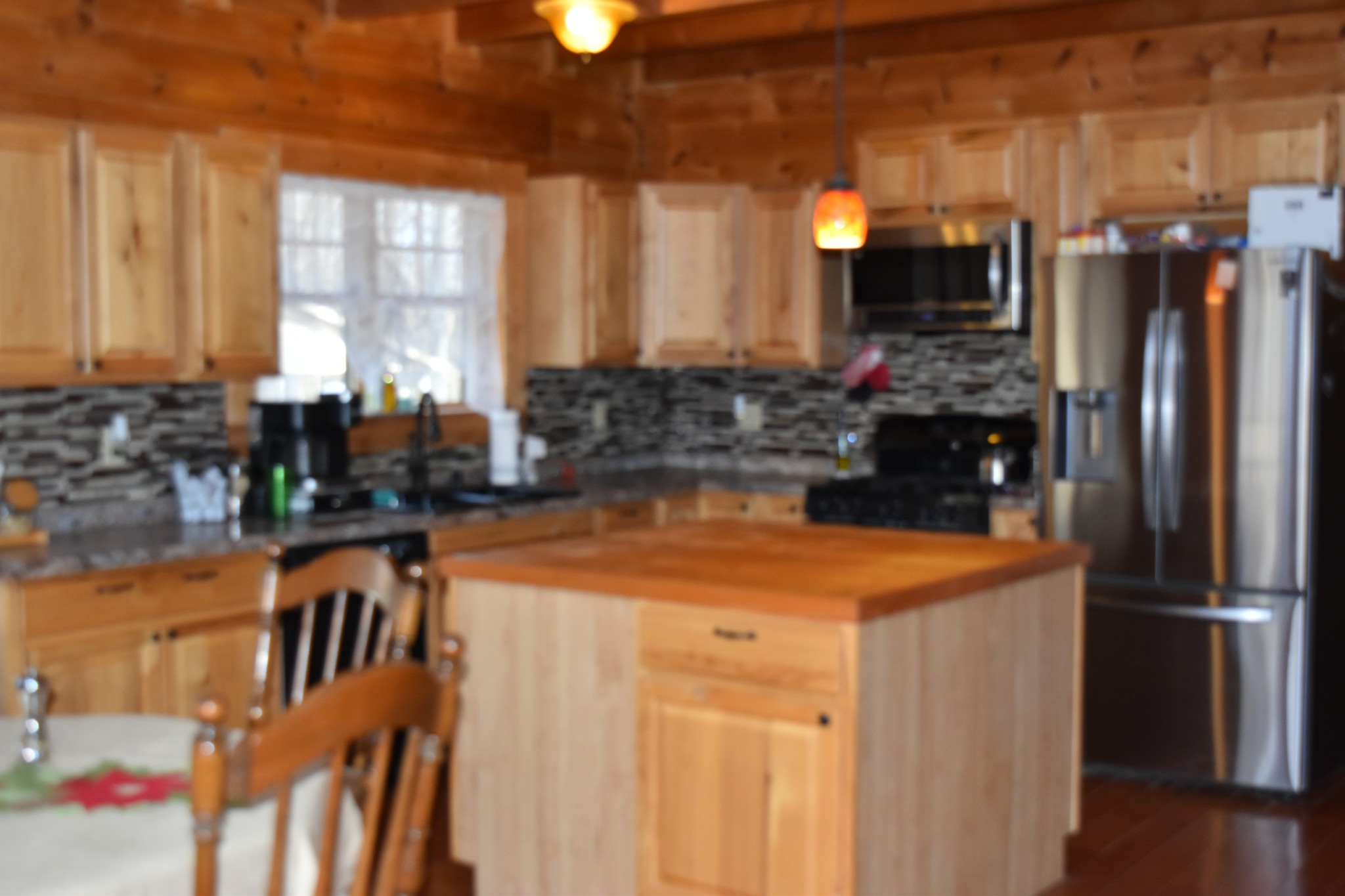 271 Ingman Clf Road Tracy City, TN 37387 - Photo 48 of 70 a kitchen with stainless steel appliances granite countertop a sink a stove and a refrigerator