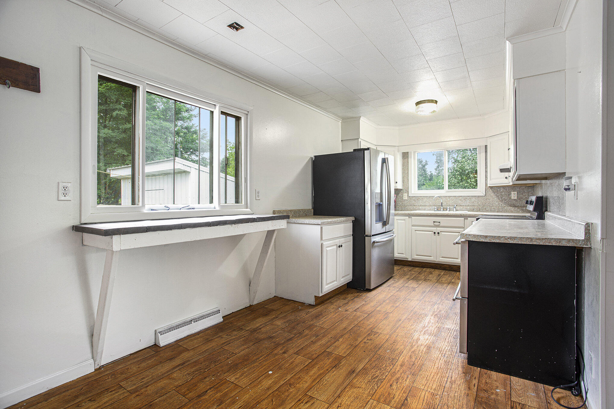 1064 South Sheridan Road Stanton, MI 48888 - Photo 10 of 28 Kitchen w Stainless Fridge and Stove