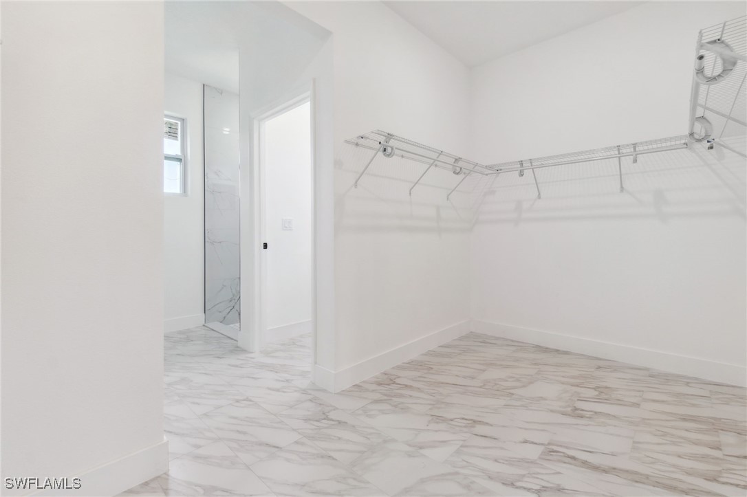 8 Cleat Court Placida, FL 33946 - Photo 14 of 24 a view of an empty walk in closet with empty racks