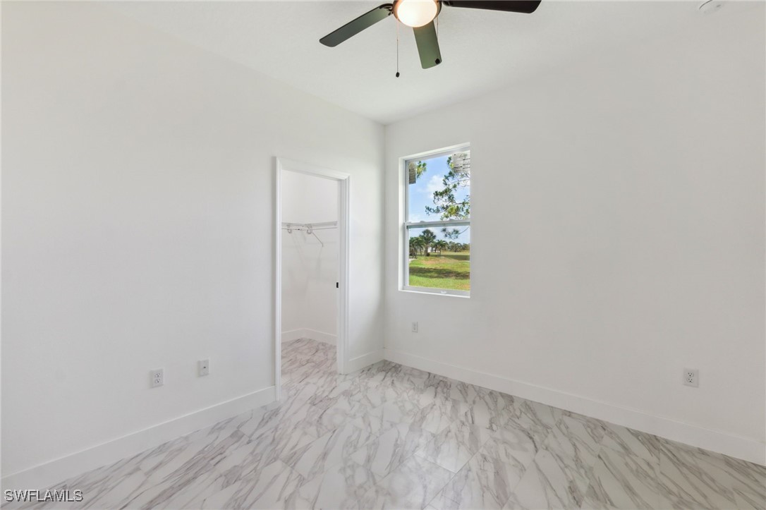 8 Cleat Court Placida, FL 33946 - Photo 18 of 24 an empty room with window and ceiling fan