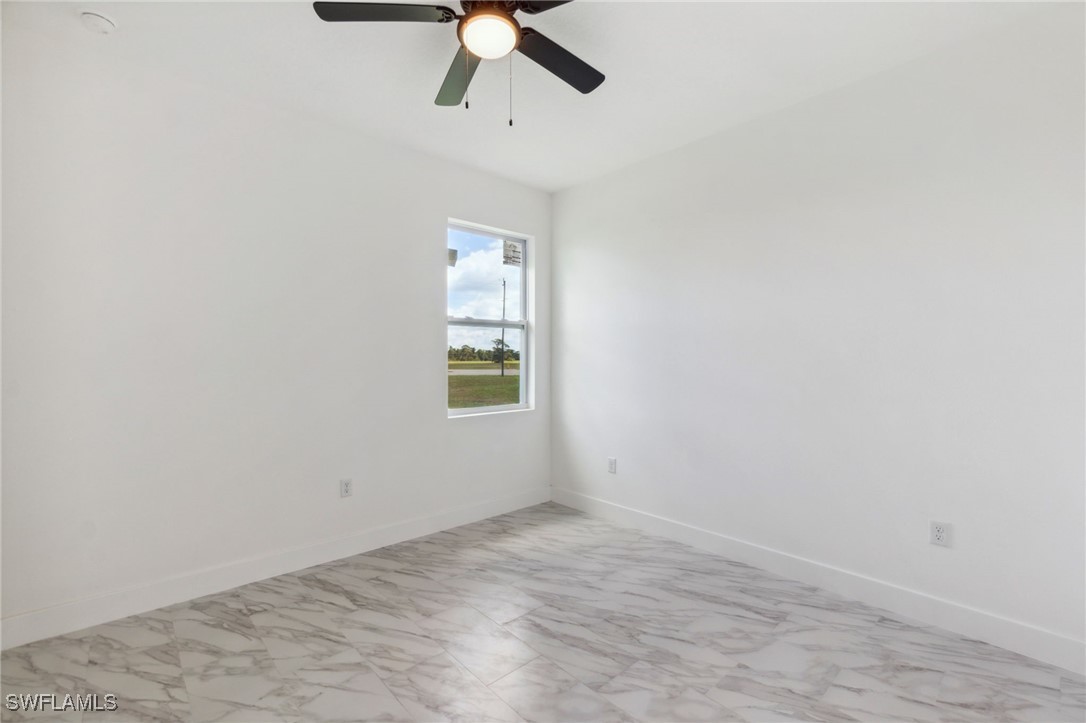 8 Cleat Court Placida, FL 33946 - Photo 19 of 24 an empty room with a window and a ceiling fan