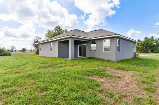 a aerial view of a house with big yard