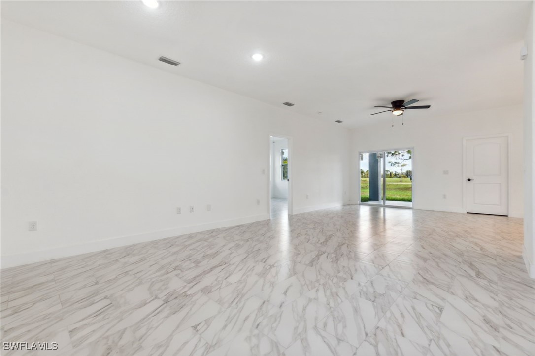 8 Cleat Court Placida, FL 33946 - Photo 6 of 24 a view of an empty room with window and wooden floor