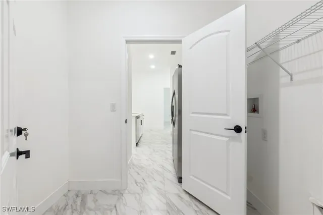 a bathroom with a shower and a glass door