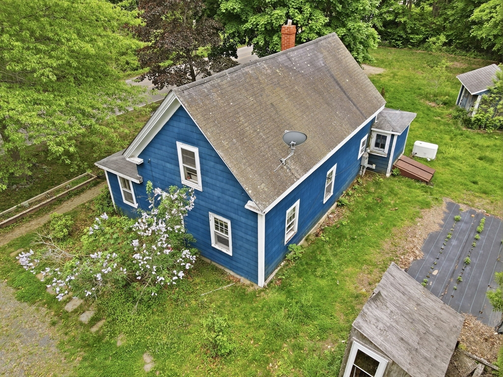 200 Stockbridge Road Scituate, MA 02066 - Photo 10 of 14 a aerial view of a house with a yard table and chairs