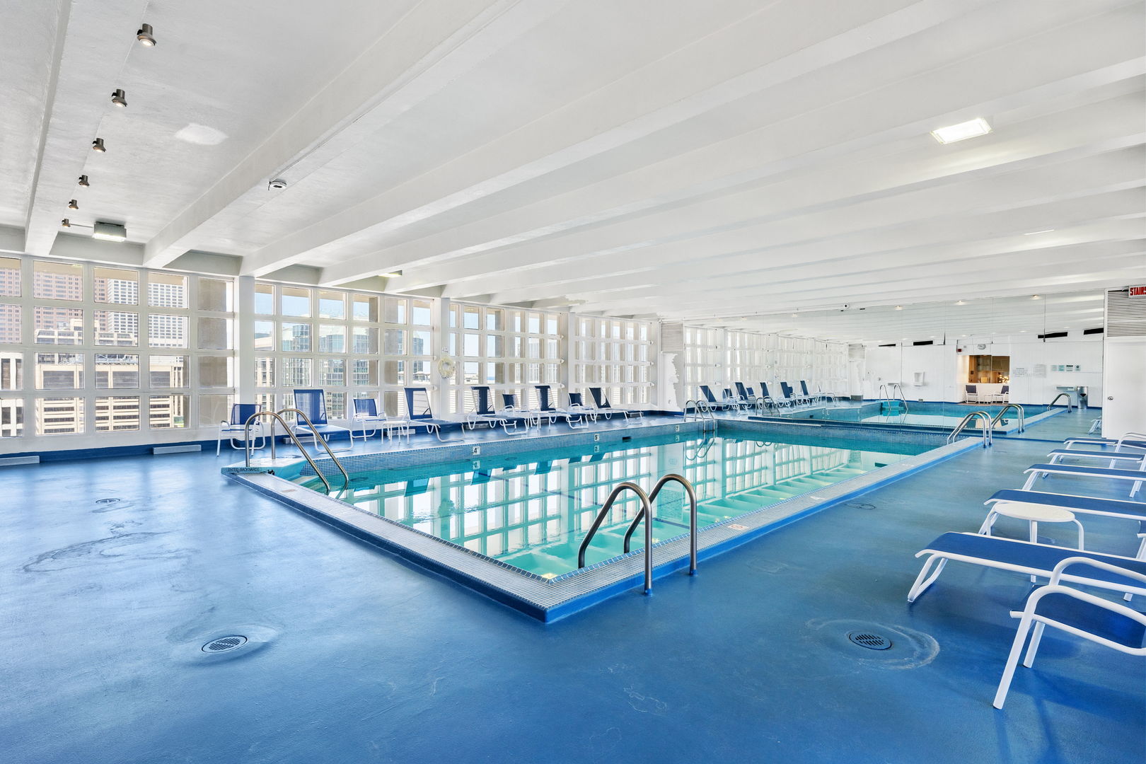 535 North Michigan Avenue, Unit 1710 Chicago, IL 60611 - Photo 11 of 17 a view of game room with window and wooden floor