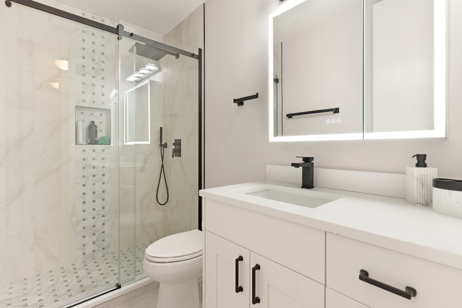 535 North Michigan Avenue, Unit 1710 Chicago, IL 60611 - Photo 6 of 17 a bathroom with a sink a toilet and shower