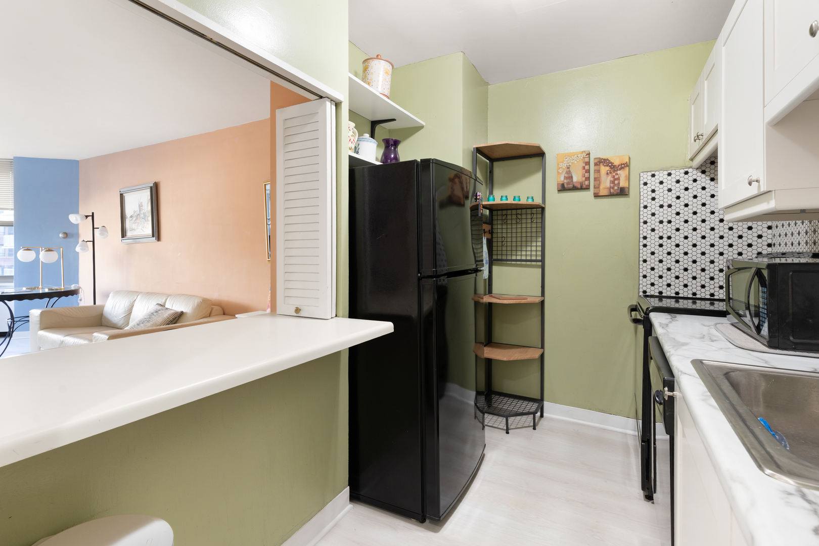 535 North Michigan Avenue, Unit 1710 Chicago, IL 60611 - Photo 7 of 17 a bathroom with a sink and a refrigerator