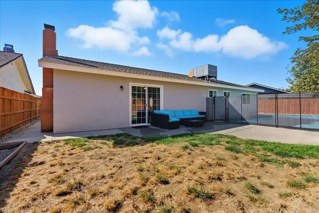 a view of a backyard of the house